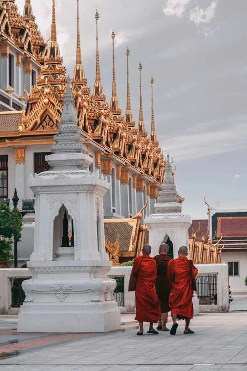 Monks visiting a temple in Bangkok, Thailand,