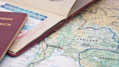 Close up image of Thailand passport with a map along its side.