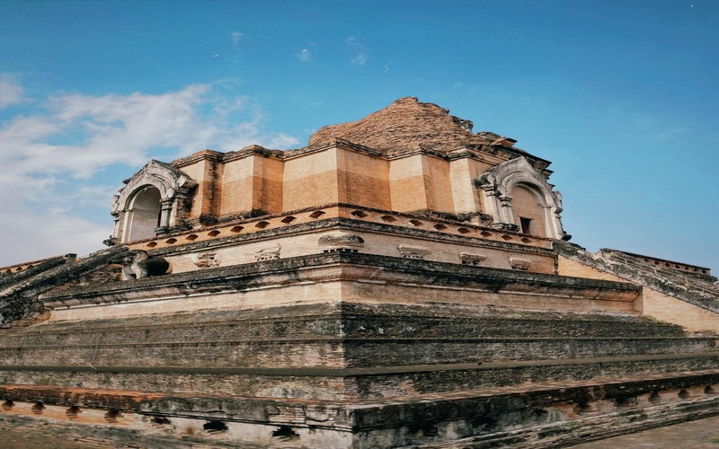 Wat Chedi Luang in Chiang Mai, Thailand, shines in daylight, radiating spiritual energy and ancient charm.